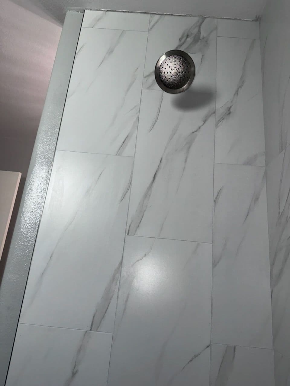 Sleek Bathroom Upgrade with New Tiles and Fixtures