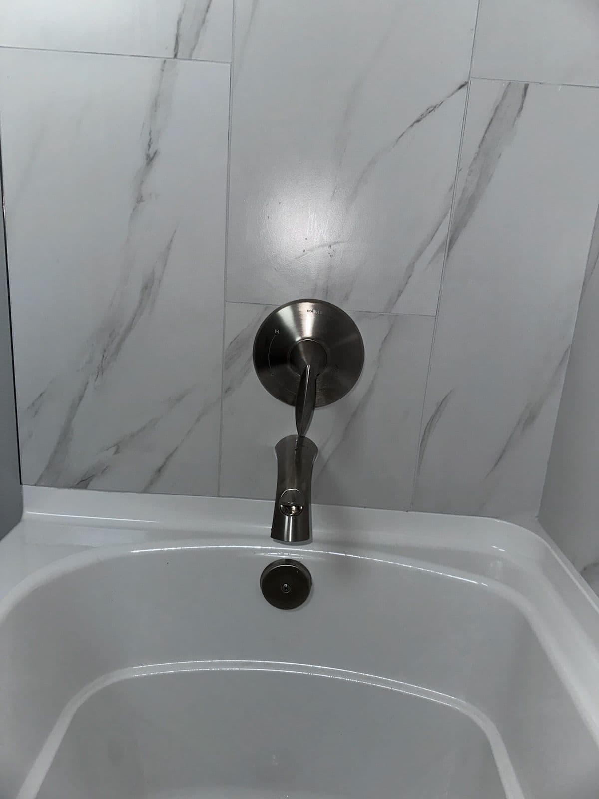 Gallery photos for Sleek Bathroom Upgrade with New Tiles and Fixtures: Image #1